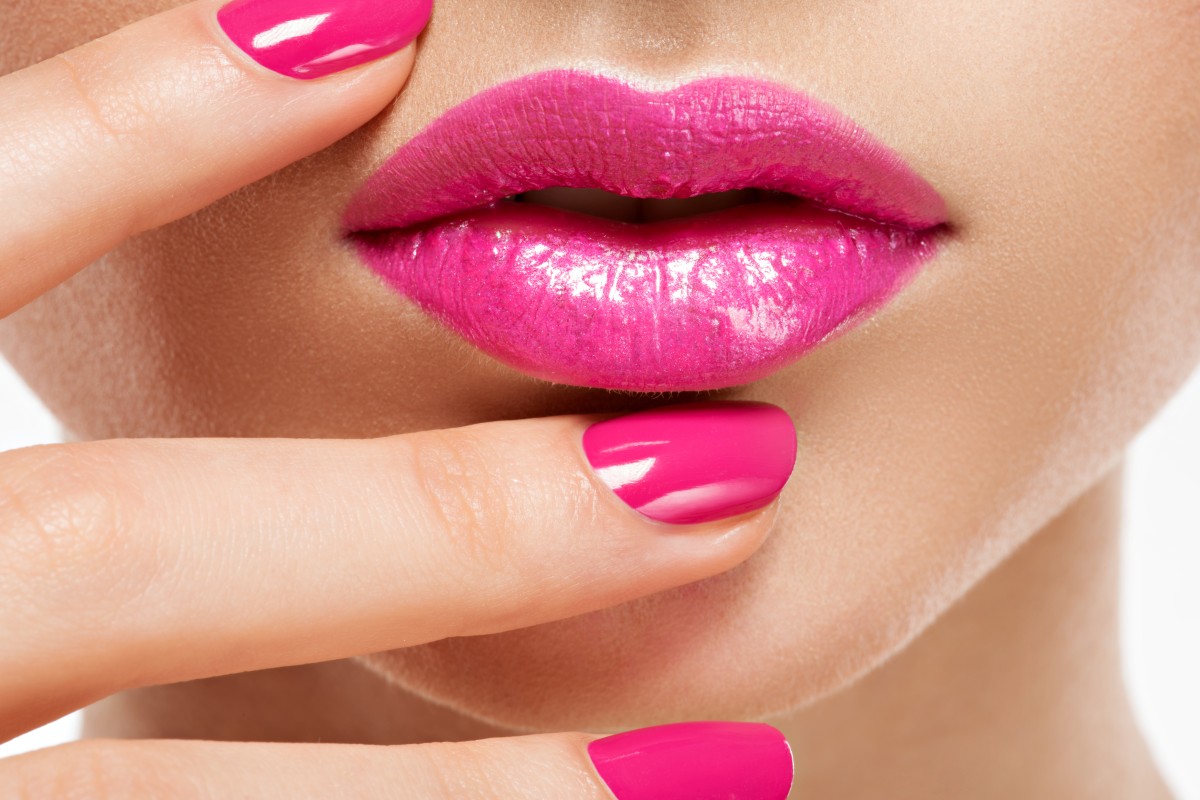 closeup-woman-hand-with-pink-nails-near-lips-fingernails-with-pink-manicure (2) (1)